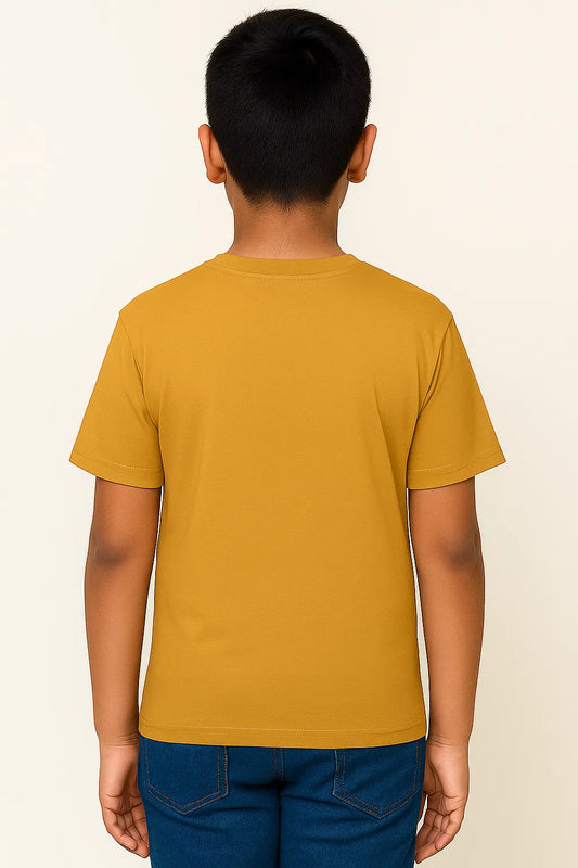 Person wearing a mustard yellow t-shirt on a beige background