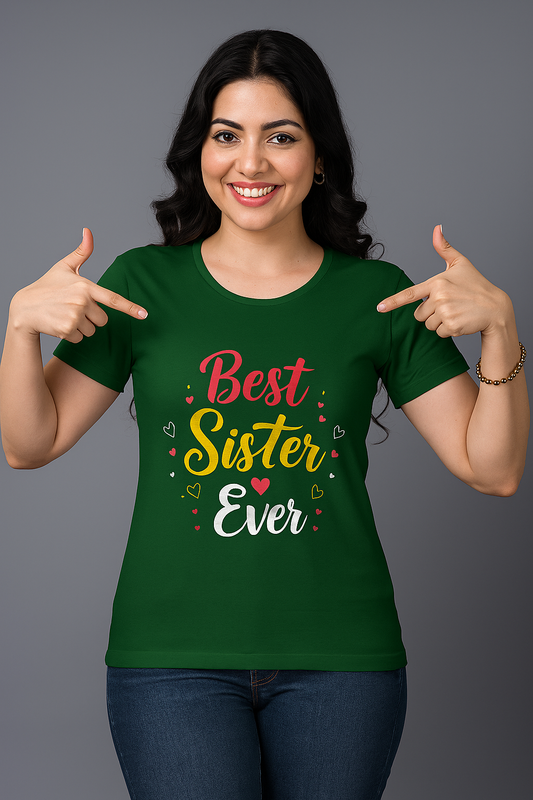 Woman wearing a green t-shirt with 'Best Sister Ever' text, pointing at it.